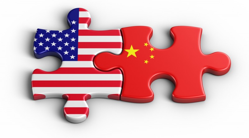 [interlocking Chinese and American flag puzzle pieces]
